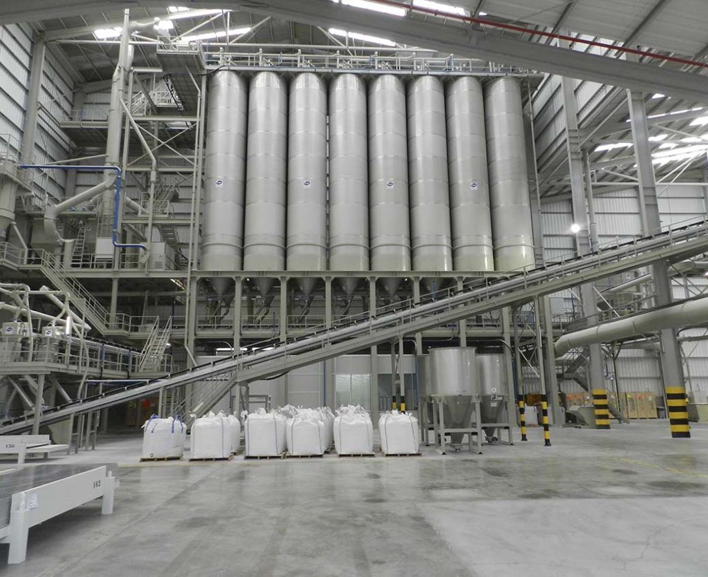 Inside a ceramic factory showing the silos for tile manufacturing ingredients.